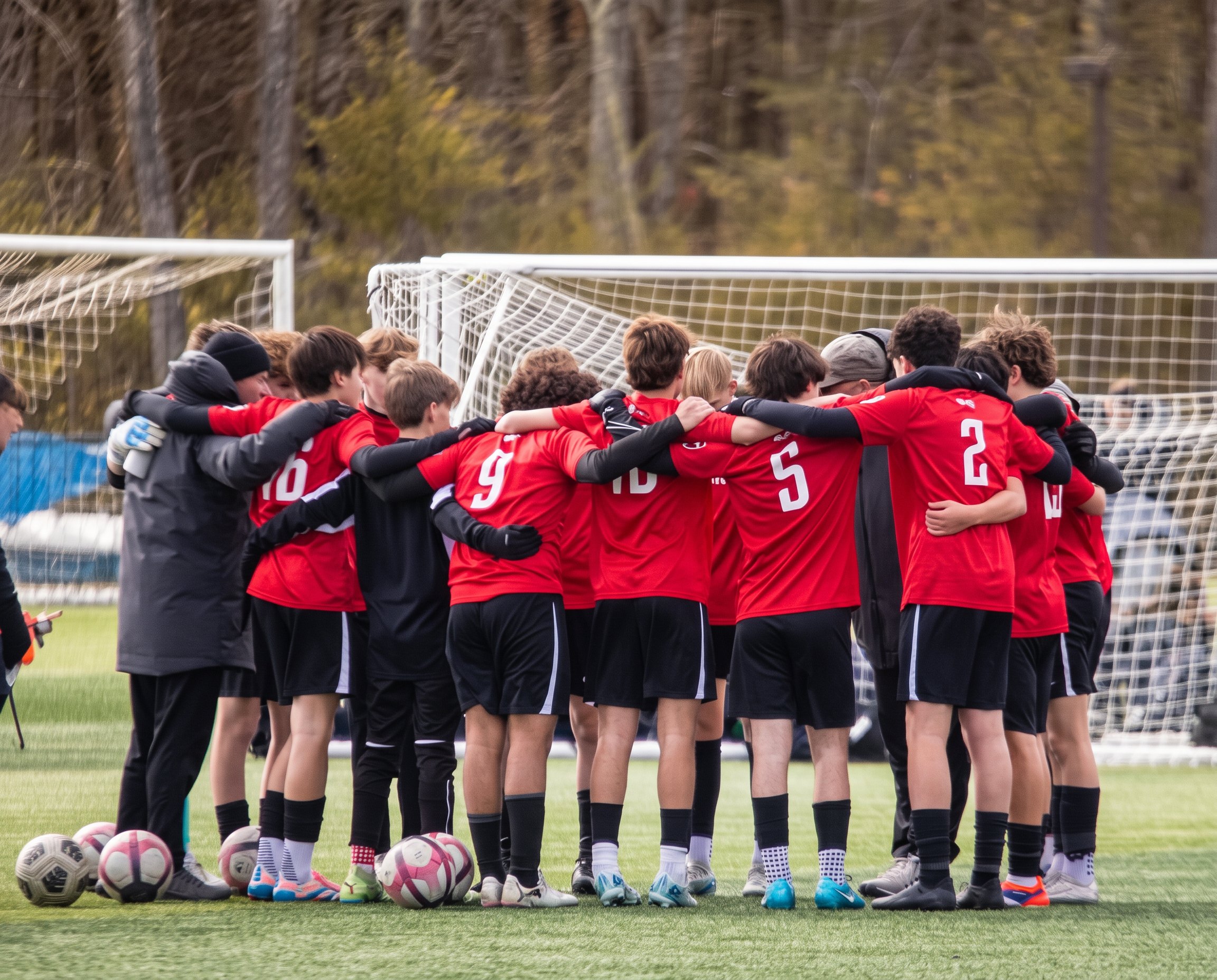 Youth soccer players in a huddle